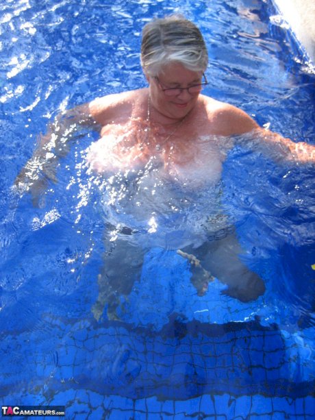 Fat nan Girdle Goddess goes for a skinny dip in a backyard pool