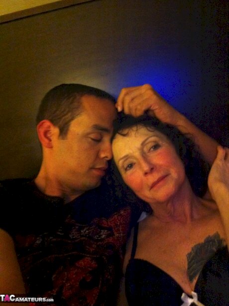 Curly haired mature woman likes sending her younger partner provocative photos
