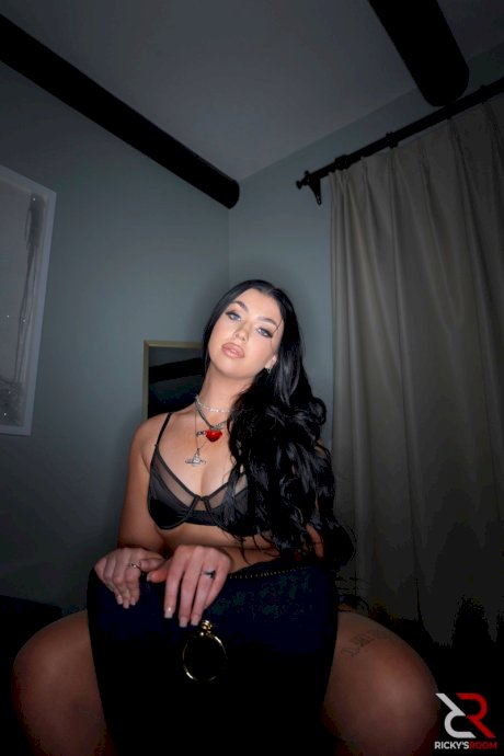 Dark haired MILF Holly Day rocks her booty while greeting her man friend