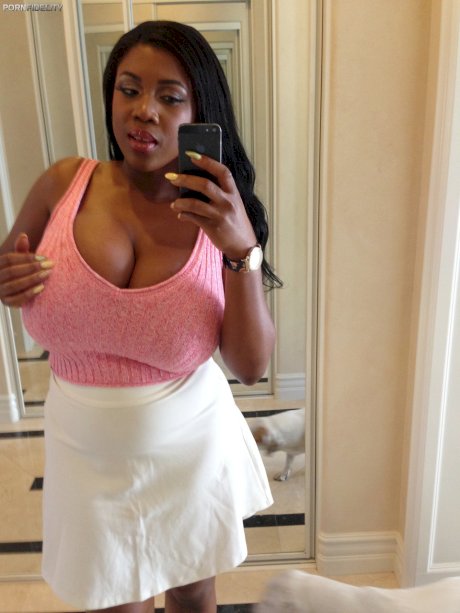 Curvy black haired ebony Maserati XXX displays her massive melons in a solo