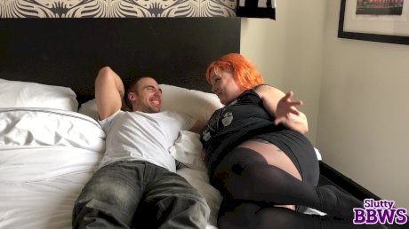 Redheaded fatty concludes a handjob with sperm on her face and tits