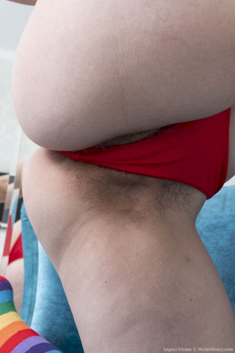 Brunette amateur Legazi Divine displays her grand juggs & rubs her bushy twat