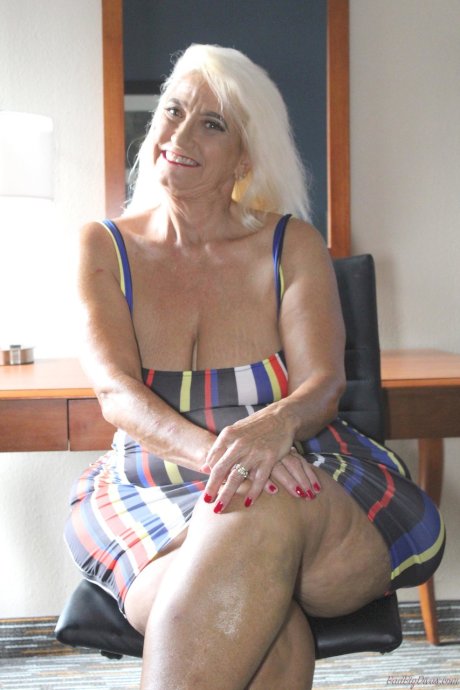 Blonde granny Amber Conners hikes her dress up to show her massive ass