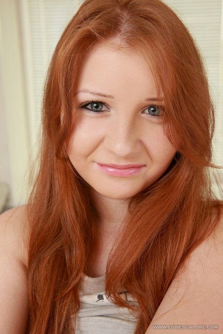 Innocent redhead Jess shows her big tits and masturbates with a dildo