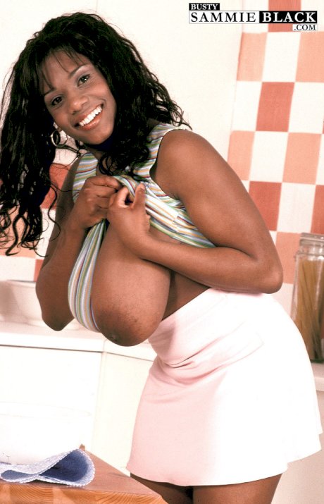 Curvaceous ebony cutie Sammie Black plays with flour and her massive juggs