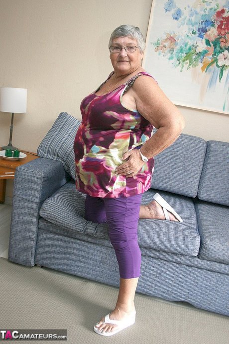 Huge fatty granny baring her saggy boobs & spreading her horny pussy wide open
