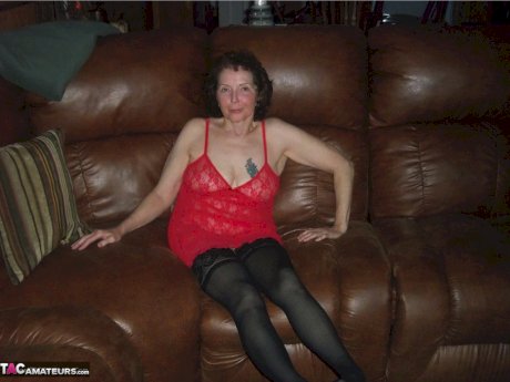 Curly haired mature woman likes sending her younger partner provocative photos