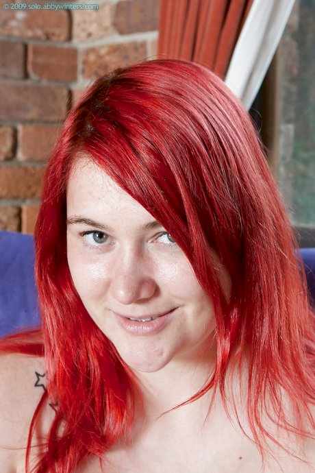 Chubby redhead teen Adalin shows off her puffy hairy pussy and fat butt