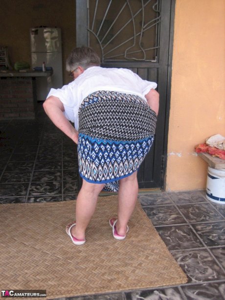 Old amateur Girdle Goddess exposes her obese body outside her front door