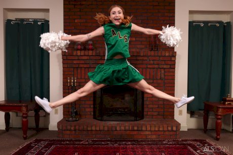 Young redheaded cheerleader Scarlet Skies gets naked for Kegel exercises
