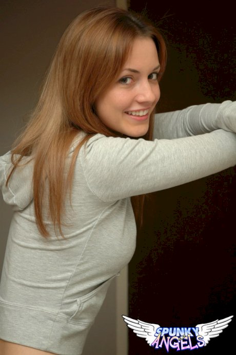 Amateur model with a pretty face poses non nude in denim jeans