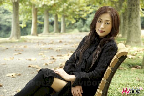 Fully clothed Japanese teen models in the park in black clothes and stockings