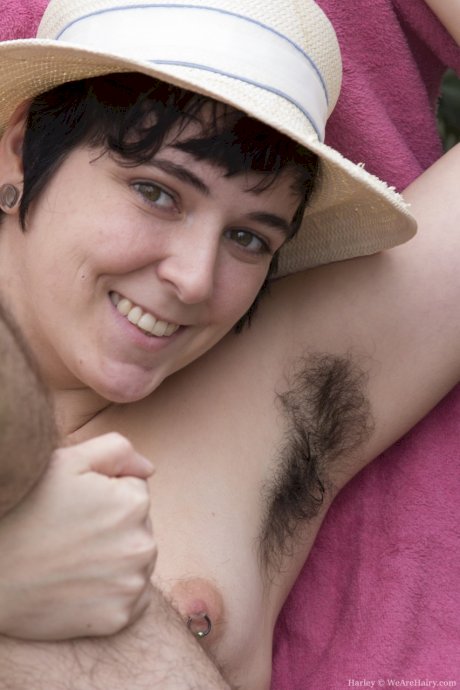 Short haired chick Harley unveils her hairy body, armpits, legs and pussy