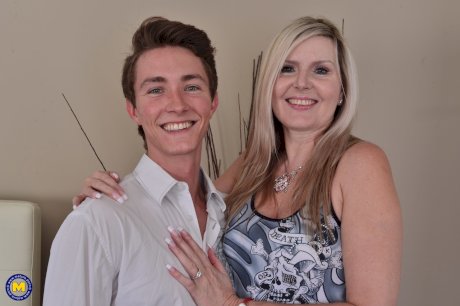 Middle aged woman shows her neighbor's boy the ways of sex in her bedroom