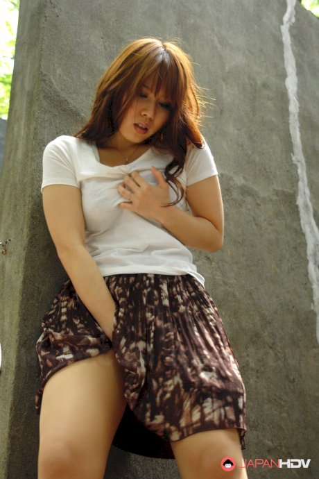 Asian brunette Eri Makino plays with her big juggs and gets fucked outdoors