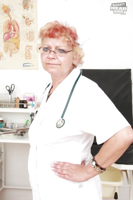 Filthy granny in nurse uniform stretching her twat by her fingers