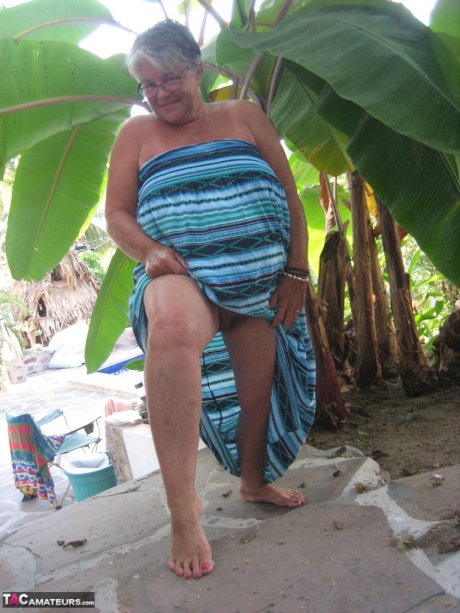 Old woman Girdle Goddess smokes before exposing her fat body on her patio