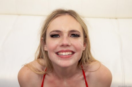 Natural blonde Rebel Rhyder gets on her knees for three big cocks