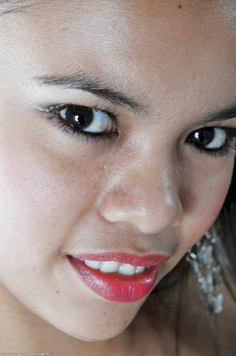 Petite Asian chick Clarice modelling solo in sexy French maid uniform