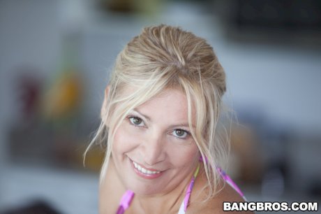 Enormous big tits of milf Ingrid Swenson in bikini will turn you on