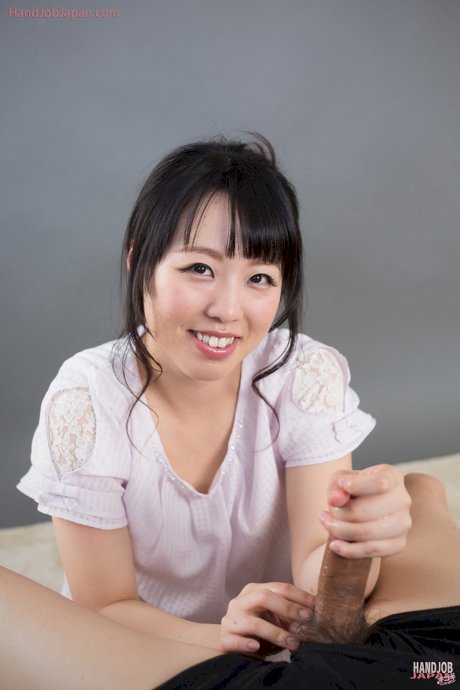 Clothed Japanese female licks sperm from fingers after giving a handjob