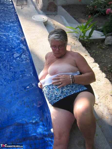 Fat nan Girdle Goddess goes for a skinny dip in a backyard pool