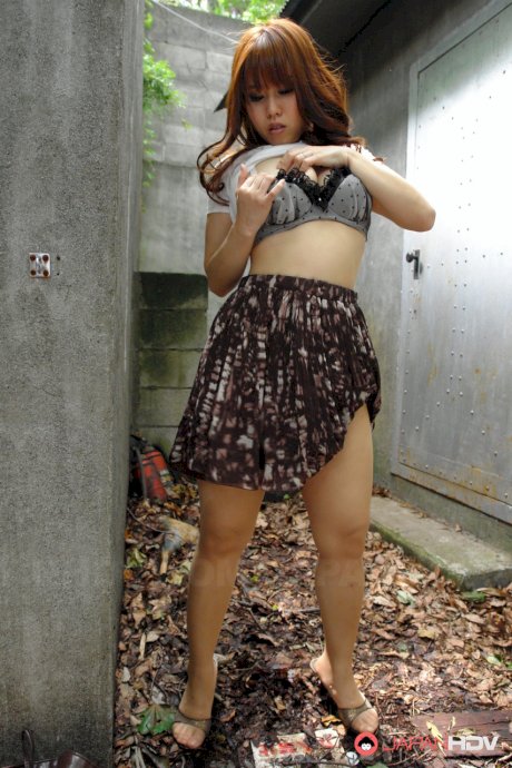 Asian brunette Eri Makino plays with her big juggs and gets fucked outdoors
