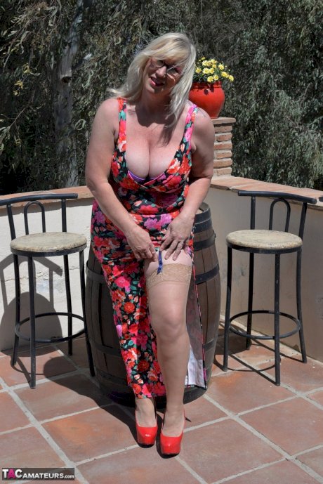 Blonde amateur Melody exposes her big butt on a balcony in her lingerie