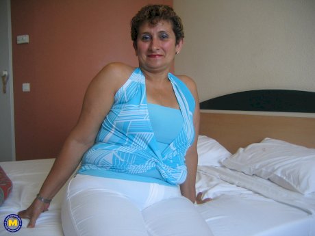 Short haired granny Gina unveils her big tits and toys her hairy pussy