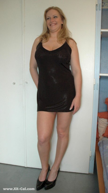 Beautiful amateur MILF in a black dress Zdenka K exposes her sexy legs and ass