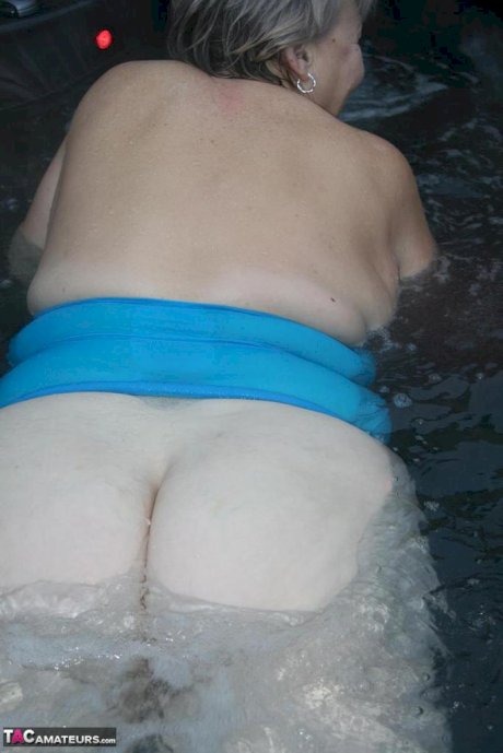 Old woman Valgasmic Exposed plays with her breasts while hot tubbing