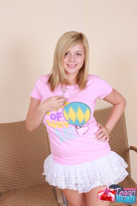 Cute teen girl Tegan Brady teases in a micro skirt and over the knee socks