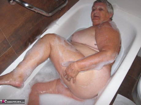 Morbidly obese woman Grandma Libby shaves before taking a bubble bath