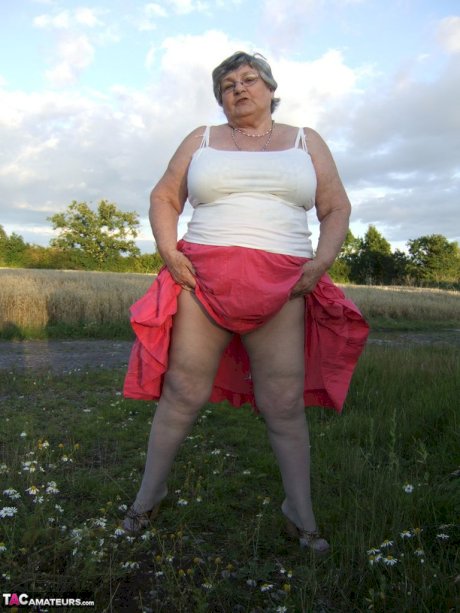 Obese oma Grandma Libby exposes her huge ass while in a field by a rural road