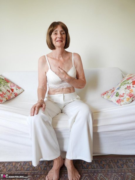 Barefoot granny Kat Kitty gets completely naked during solo action