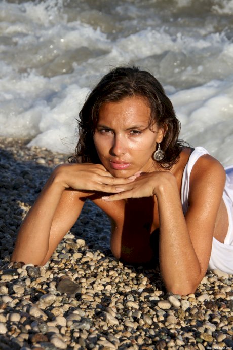 Exotic naturally busty teen model Madlen strips naked & poses in the sea