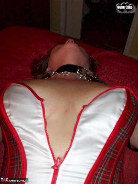 Mature lady Busty Bliss sports nipple clamps after being handcuffed