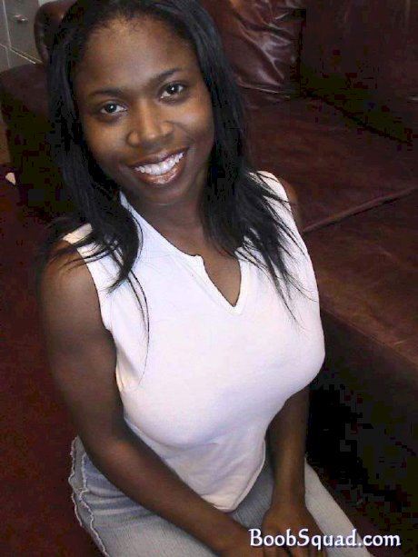 Ebony cutie Carla unveiling her huge natural breasts and round booty