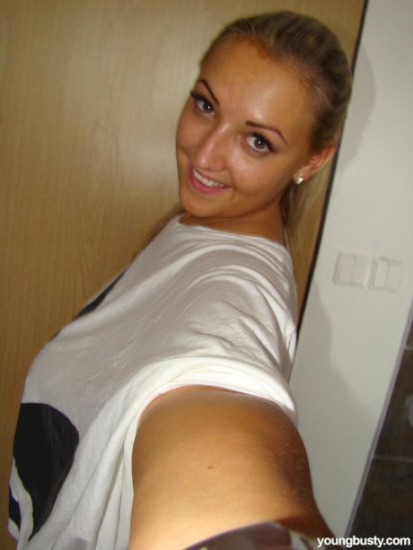 Chubby blonde babe Krystal unveils her huge breasts and shaved vagina