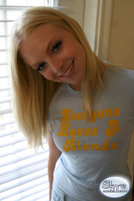 Blonde amateur Skye Model models by herself in a short skirt