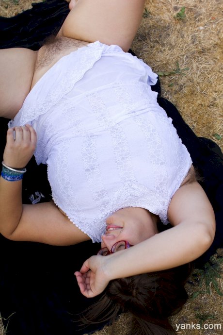 Fat amateur brunette with glasses Betty H shows off her giant tits outdoors