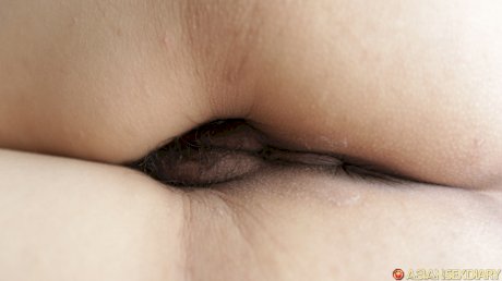 Brunette Asian MILF Oil B shows her hairy pussy and takes a boner deeply