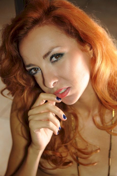Sexy redheaded babe Vetta reveals her small boobs & rubs her twat on the floor