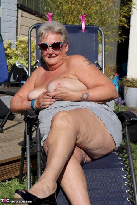 Fat nan Valgasmic Exposed shows her tits and snatch on a backyard lounge chair