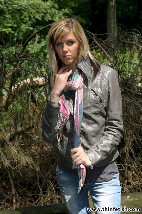 Anorexic blonde grabs her bare ass after disrobing in the woods