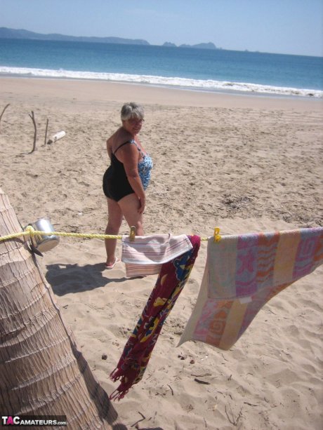 Fat granny Girdle Goddess takes off swimwear to pose nude at the ebach