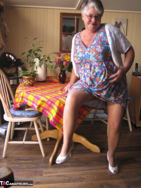 Fat granny Girdle Goddess exposes her huge boobs in a girdle and nylons