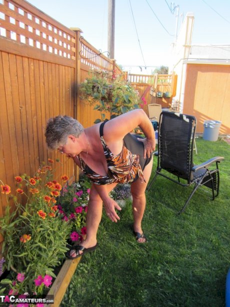 Fatty mature granny Girdle Goddess peels to enjoy wading pool skinny dip
