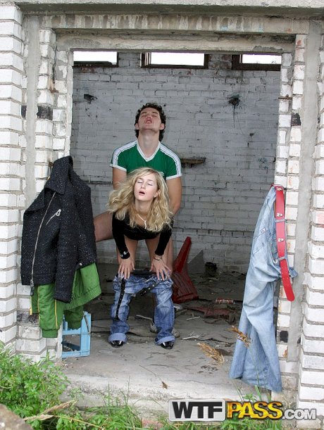 Blonde girl does hardcore anal in an abandoned building with strangers