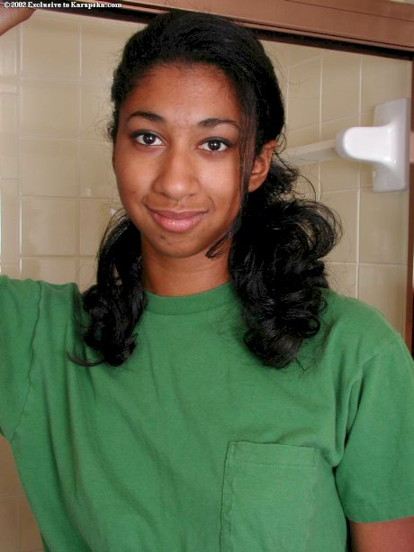Tall ebony girl undresses before wetting her full bush in shower